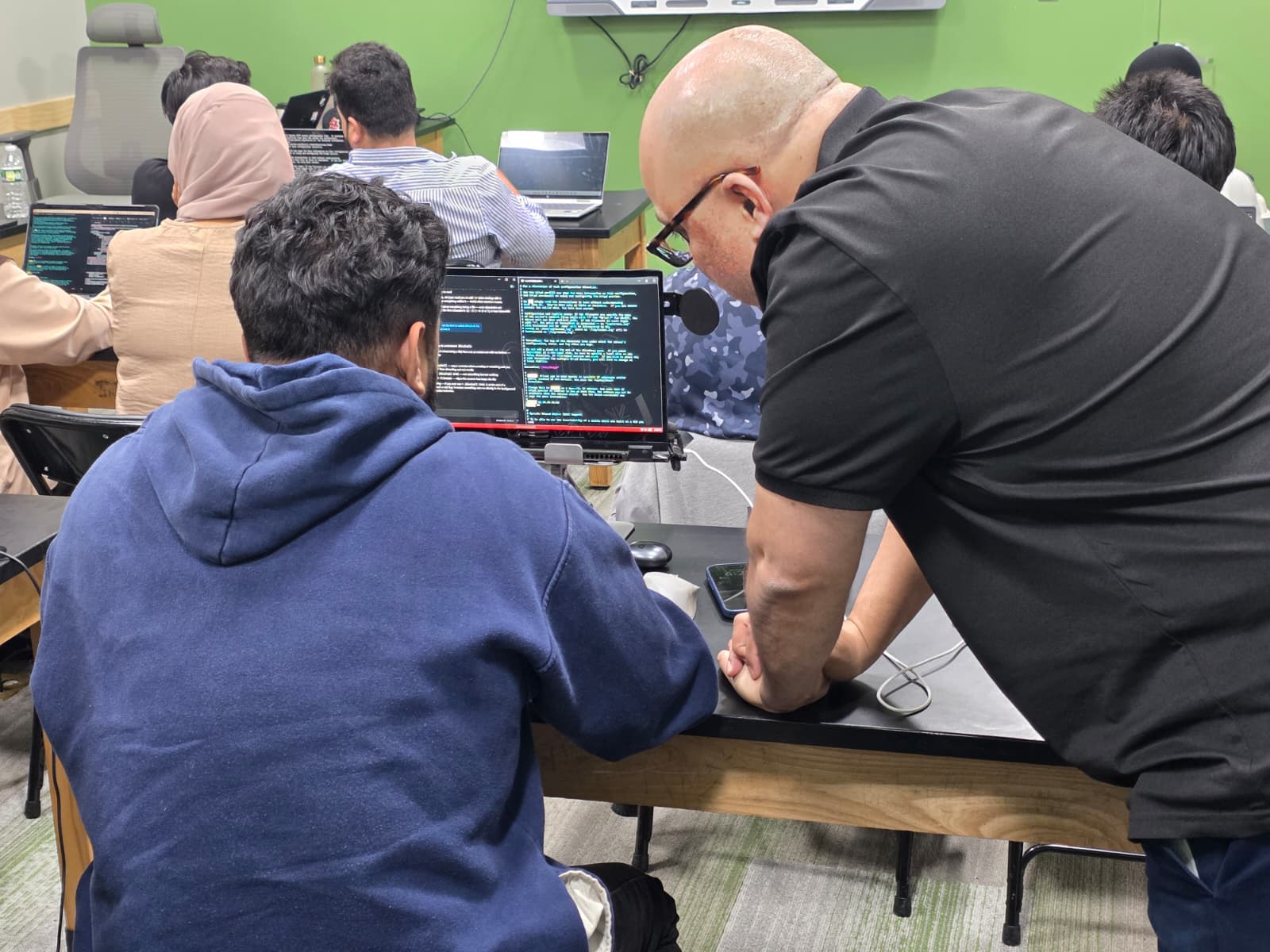 SKAISTACK instructor giving one-on-one guidance to a student