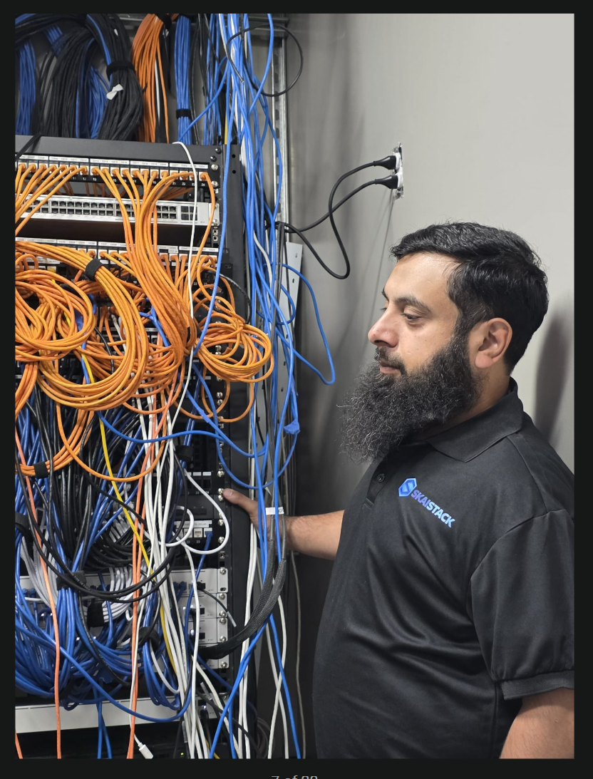 SKAISTACK instructor working hands-on with network infrastructure